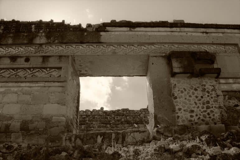 An eponymous photograph of Mitla that details the archaeological zone’s mosaic fretwork and utilizes a window to frame sky and clouds.